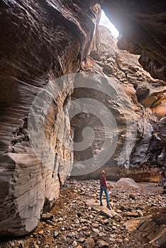 Young woman hiker in scenic canyon Barranco Bermeja, volcanic rock canyon in Tenerife, Canary islands, Spain. photo