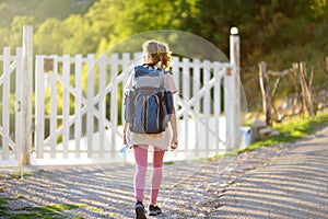 Young woman hiking in forests and mountains of Europe. Concepts of adventure, extreme survival, orienteering. Tourists camp