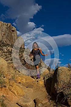 Young woman hiking Granite Mountain in Arizona