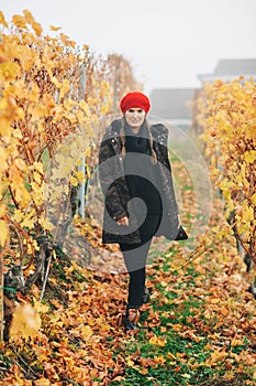 Young woman hiking in Lavaux vineyards in autumn