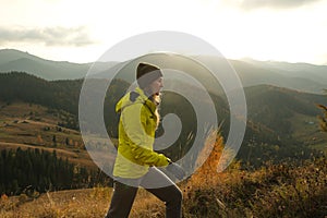 young woman hiking in mountains