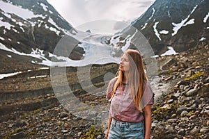 Young woman hiking in Norway outdoors travel adventure vacations