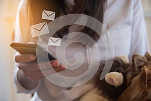 Young woman hold cellphone and send email, business concept