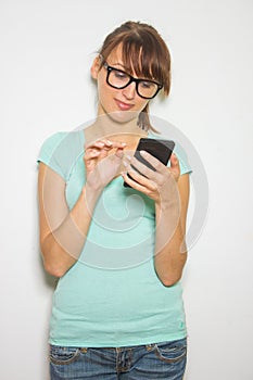 Young woman hold digital calculator. Female smiling model isolated white background