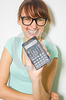 Young woman hold digital calculator. Female smiling model isolated white background