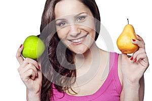 Young woman holding an apple and a pear