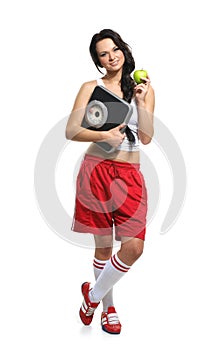 A young woman holding an apple and scales