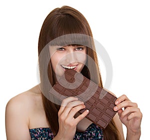 Young woman holding big chocolate bar