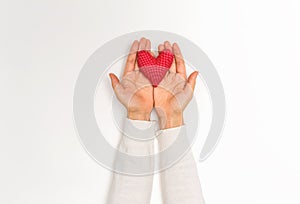 Young woman holding a big Valentine`s day heart