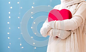 Young woman holding a big Valentine`s day heart