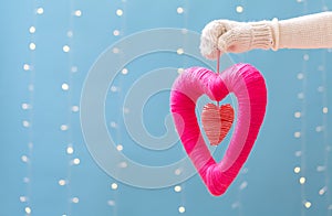 Young woman holding a big Valentine`s day heart