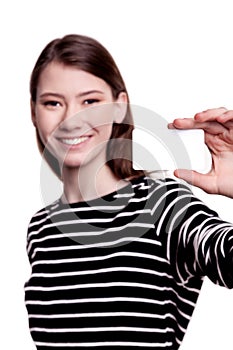 Young woman holding blank business card