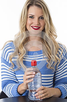 Young Woman Holding Bottle of Mineral Water