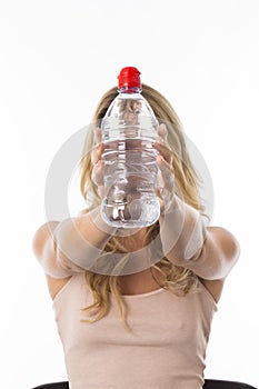 Young Woman Holding a Bottle of Mineral Water