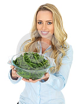 Young Woman Holding a Bowl of Cooked Green French Beans