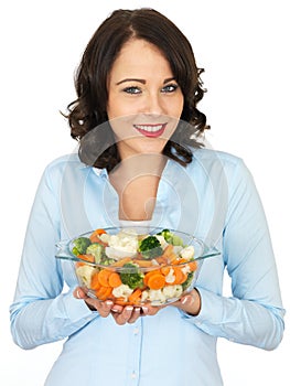 Young Woman Holding a Bowl of Mixed Vegetables