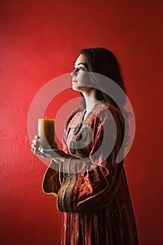 Young Woman Holding Candle