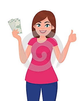 Young woman holding cash/currency/money in hand and showing thumbs up sign. Deal, agree, approve, success, business and finance.