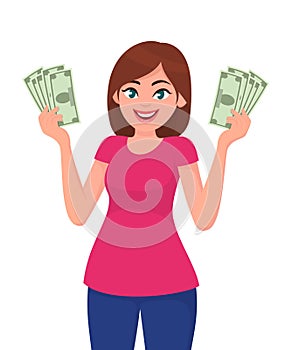 Young woman holding cash/money in hands.