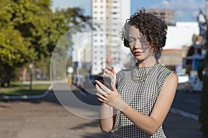 Young woman holding a cellphone