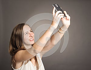 Young woman holding a cellular