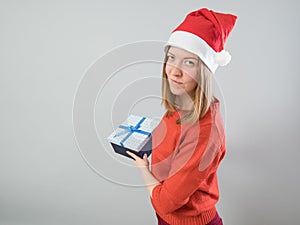 Young woman holding christmas gift