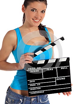 Young woman holding clapperboard