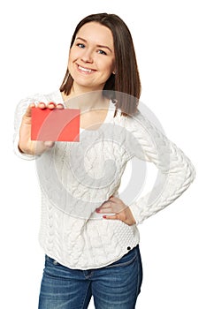 Young woman holding empty credit card, over white background