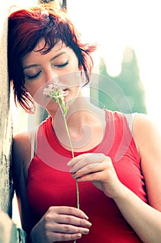 Young Woman Holding Flower