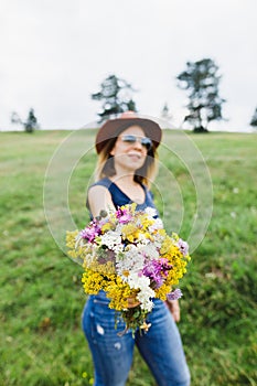 Young woman holding flower bouquet
