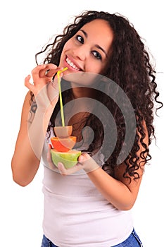 Young woman holding fruits. Isolated over white