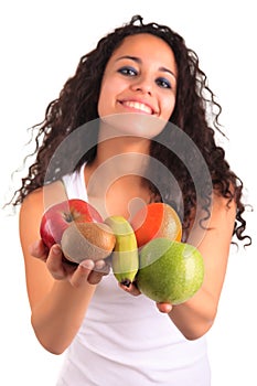 Young woman holding fruits. Isolated over white