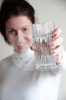Young woman holding glass