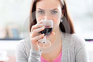 Woman having glass of wine