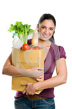 Young woman holding a grocery bag