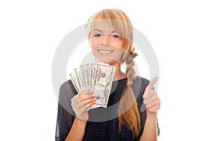 Young woman holding in hand cash money dollars