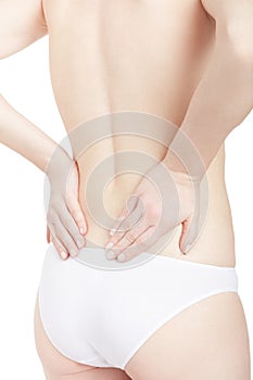 Young woman holding hands for back pain, backache