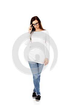 Young woman holding her glasses