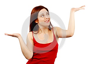 Young woman holding her hands out as if balancing or weighing so