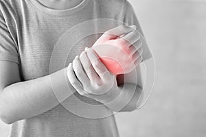 Young woman holding her wrist pain because using computer long time. De Quervain`s tenosynovitis, Intersection Symptom, Carpal
