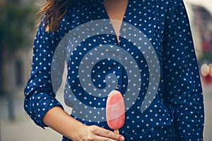 A Young Woman Holding Ice Cream