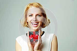 Young woman holding jewelery gift box