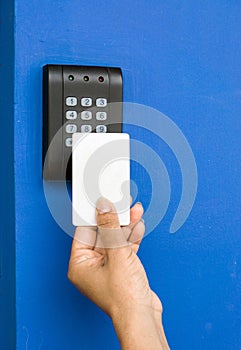 Young woman holding a key card to lock and unlock door.,