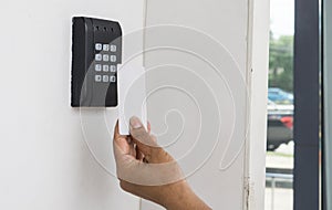 Young woman holding a key card to lock and unlock door.