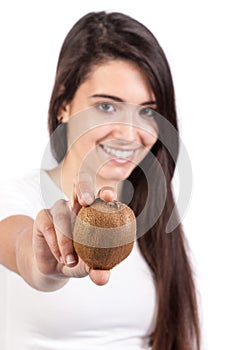 Young woman holding a kiwi