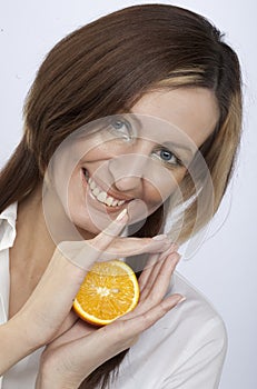 Young woman holding a lemon