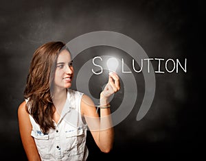 Young woman holding a lightbulb