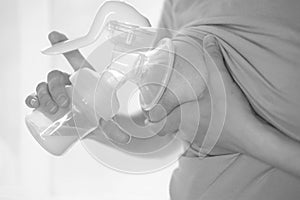 Young woman holding a machine for expressing breast milk. Concept breastfeeding. Breast pump close-up