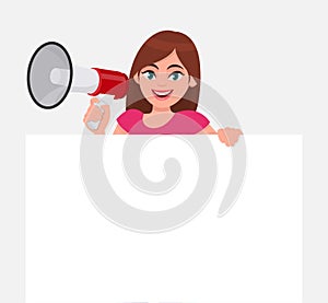 Young woman holding a megaphone or loudspeaker in hand. Girl showing a blank white poster or banner for copy space text.