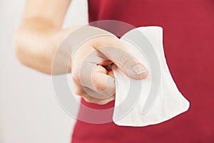 Young woman holding mentrual pad